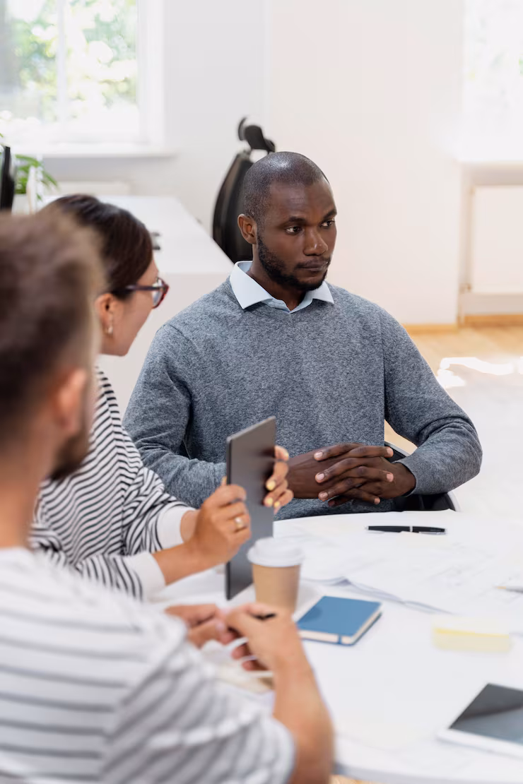 close-up-young-colleagues-having-meeting_23-2149060256
