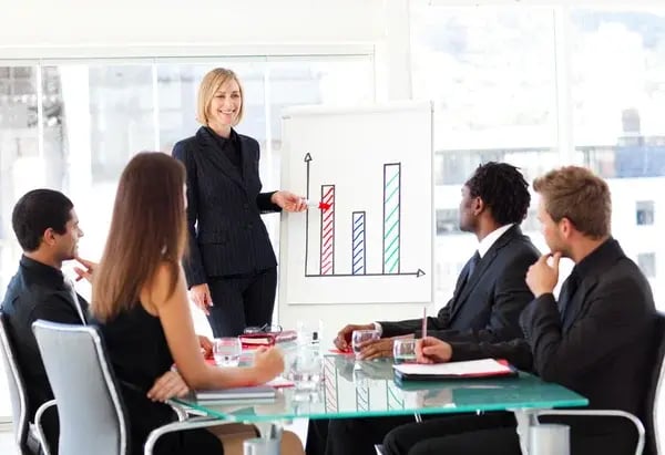 depositphotos_10312371-stock-photo-businesswoman-reporting-to-sales-in