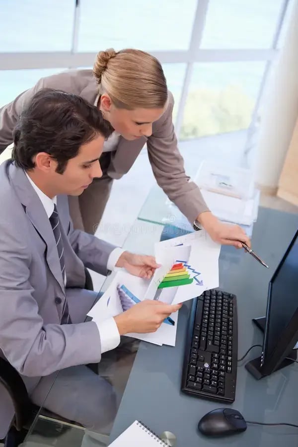focused-business-team-looking-graph-22235849